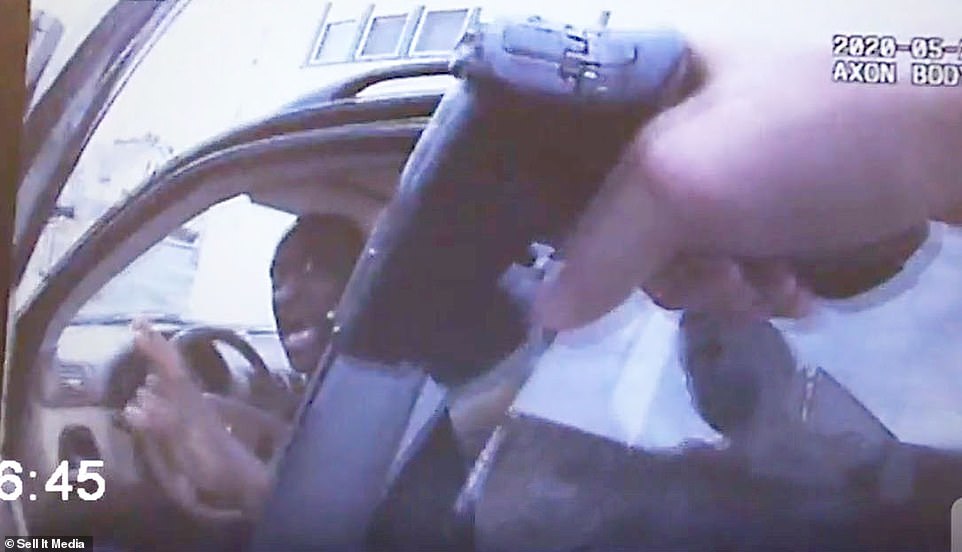 Lane is seen knocking on the car window with his flashlight, but Floyd does not immediately open the door. Once the door is open Lane immediately pulls out his handgun and points it at Floyd