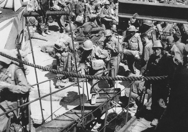 Tested beyond endurance: This official US Army photograph taken in Pozzuoli near Naples in August 1944, captured Private First Class Steve Weiss boarding a British landing craft. He is climbing the gangplank on the right-hand side of the photograph.