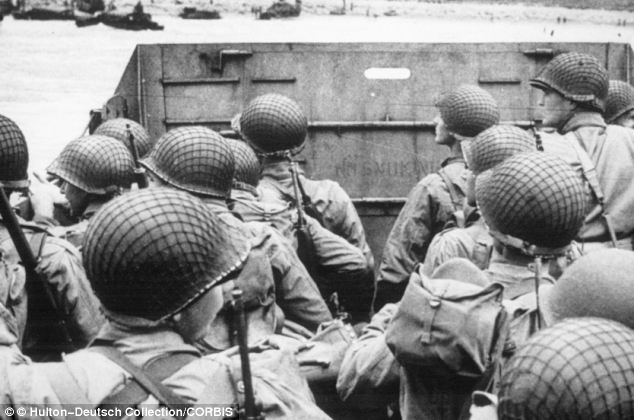 Loyalties Lost: Before deserting Alfred T Whitehead was decorated for bravery he has identified himself as the third soldier on the right, visible in profile, at the front of this D-Day landing craft approaching Normandy 6 June 1944