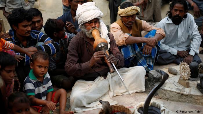 A snake charmer in India (Reuters/A. Abidi)